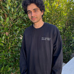 man wearing black embroidered crewneck