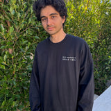 man wearing black embroidered crewneck