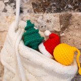 crocheted cat toys tucked in a stocking
