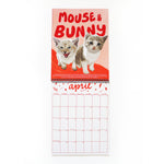 cat wall calendar open to April 2025