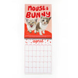 cat wall calendar open to April 2025